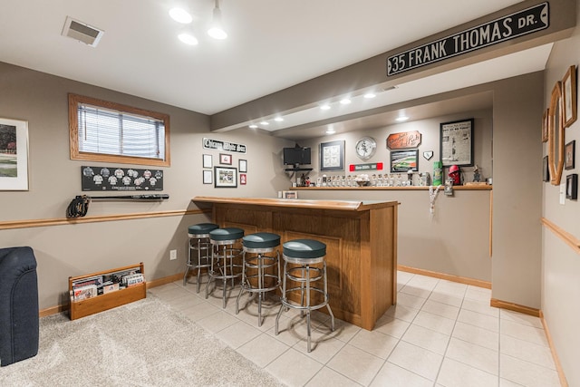 1132 Swanberg Ct, Sycamore, IL 60178 - indoor dry bar with light tile patterned floors