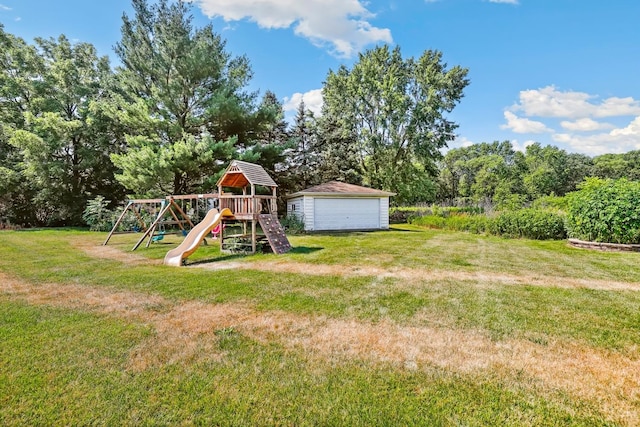 17257 W Rich Ct, Elwood, IL 60421 - view of grassy yard featuring a playground, an outbuilding, and a garage