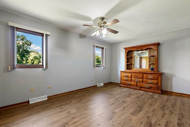 17257 W Rich Ct, Elwood, IL 60421 - unfurnished bedroom with light wood-style floors and ceiling fan
