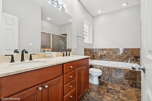 2438 N Clybourn Ave Unit 2, Chicago, IL 60614 - bathroom with double vanity, a bath, a shower stall, and stone finish floors