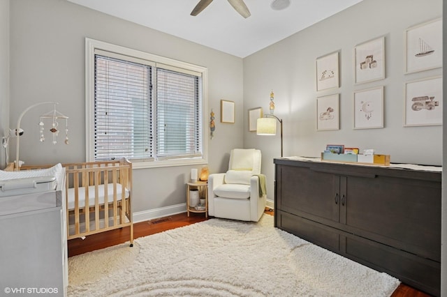 2438 N Clybourn Ave Unit 2, Chicago, IL 60614 - bedroom featuring wood finished floors, a crib, and ceiling fan