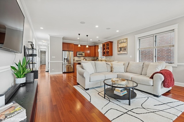 2438 N Clybourn Ave Unit 2, Chicago, IL 60614 - living area featuring light wood-style floors, ornamental molding, and recessed lighting