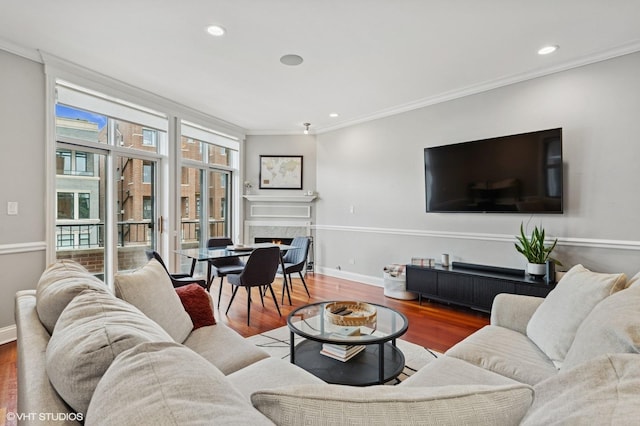 2438 N Clybourn Ave Unit 2, Chicago, IL 60614 - living room with wood finished floors, crown molding, a fireplace, and recessed lighting