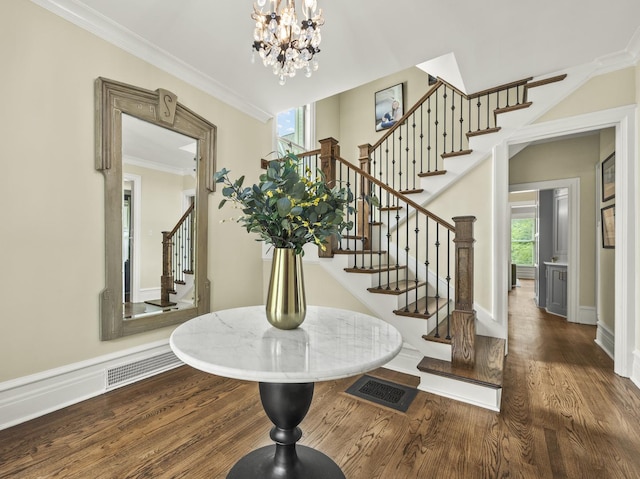 239 7th Ave, La Grange, IL 60525 - entrance foyer with stairway, wood finished floors, a chandelier, and ornamental molding