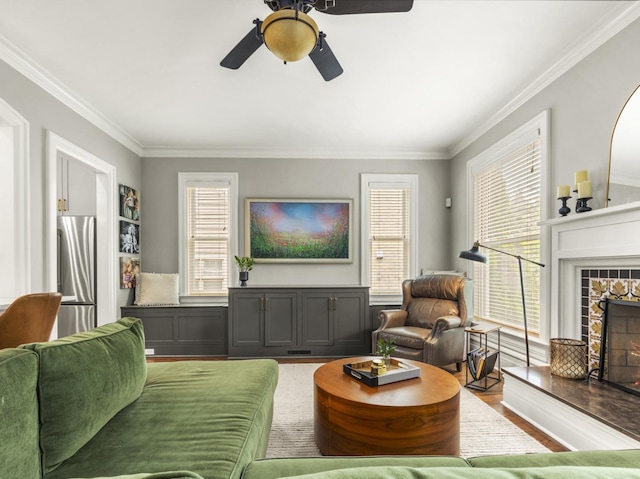 239 7th Ave, La Grange, IL 60525 - living area featuring wood finished floors, a tile fireplace, crown molding, and ceiling fan