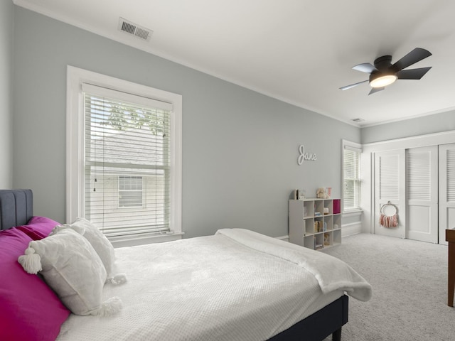 239 7th Ave, La Grange, IL 60525 - carpeted bedroom with multiple windows, a closet, and ceiling fan