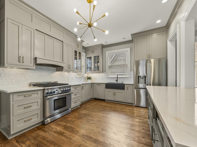 239 7th Ave, La Grange, IL 60525 - kitchen with stainless steel appliances, custom exhaust hood, gray cabinets, a chandelier, and ornamental molding