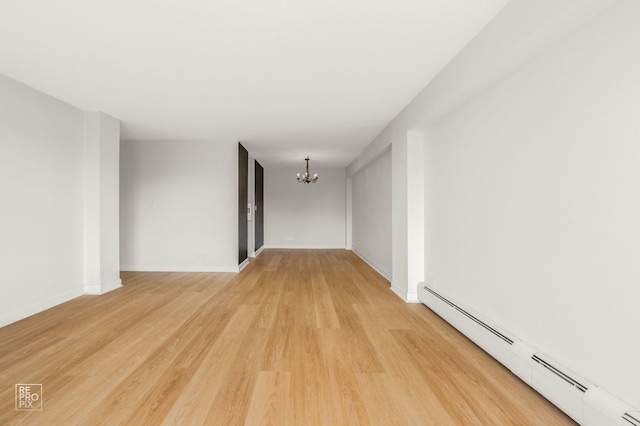 2201 S Stewart Ave Unit 4J, Lombard, IL 60148 - unfurnished room with baseboard heating, a chandelier, and light wood-style floors