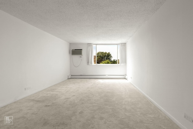 2201 S Stewart Ave Unit 4J, Lombard, IL 60148 - empty room featuring a baseboard heating unit, carpet flooring, a textured ceiling, and a wall unit AC