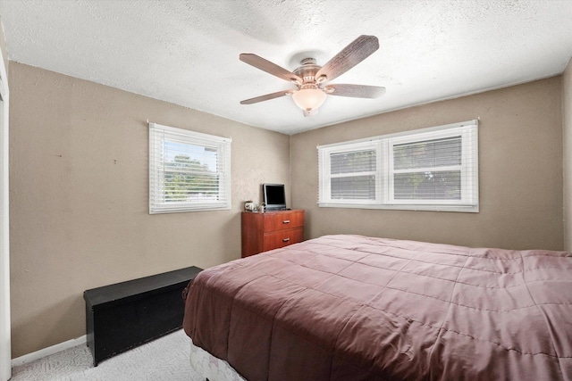 2425 Lockner Blvd, Joliet, IL 60431 - carpeted bedroom with a textured ceiling and a ceiling fan