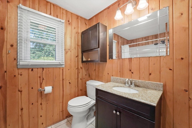 2425 Lockner Blvd, Joliet, IL 60431 - full bath with wooden walls, vanity, tile patterned floors, and a shower with curtain