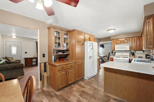 2425 Lockner Blvd, Joliet, IL 60431 - kitchen featuring white appliances, a textured ceiling, ceiling fan, light wood-style floors, and glass insert cabinets