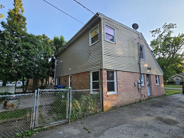 623 Westmoreland Ave, Waukegan, IL 60085 - view of property exterior with brick siding and a gate