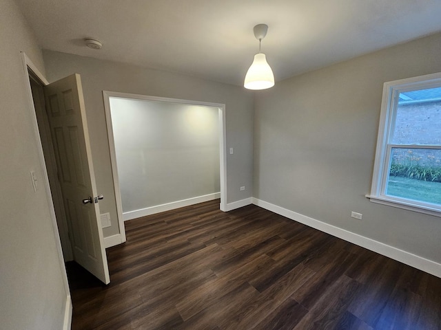 623 Westmoreland Ave, Waukegan, IL 60085 - spare room featuring dark wood-style floors and baseboards