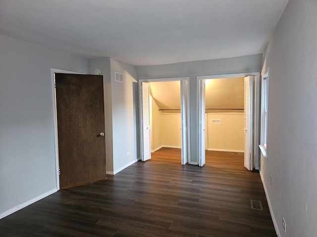 623 Westmoreland Ave, Waukegan, IL 60085 - unfurnished bedroom with dark wood-style flooring and baseboards