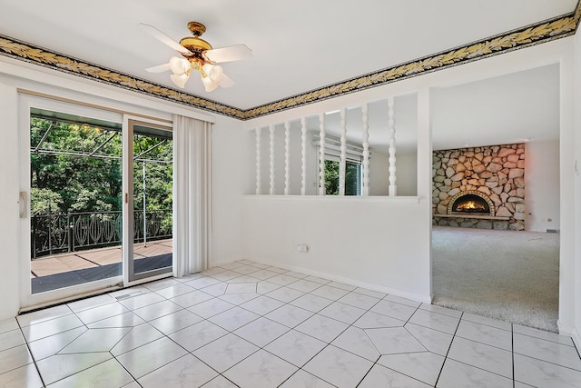 712 Ridge Rd, Lemont, IL 60439 - spare room with healthy amount of natural light, a ceiling fan, a fireplace, and light tile patterned flooring