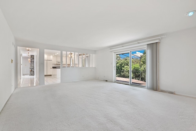 712 Ridge Rd, Lemont, IL 60439 - unfurnished living room with light colored carpet and baseboards
