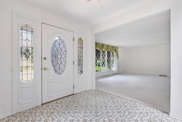 712 Ridge Rd, Lemont, IL 60439 - foyer entrance featuring light colored carpet and baseboards