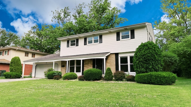 2931 Sunset Ave, Flossmoor, IL 60422 - view of front of property with a garage, driveway, a front lawn, and brick siding