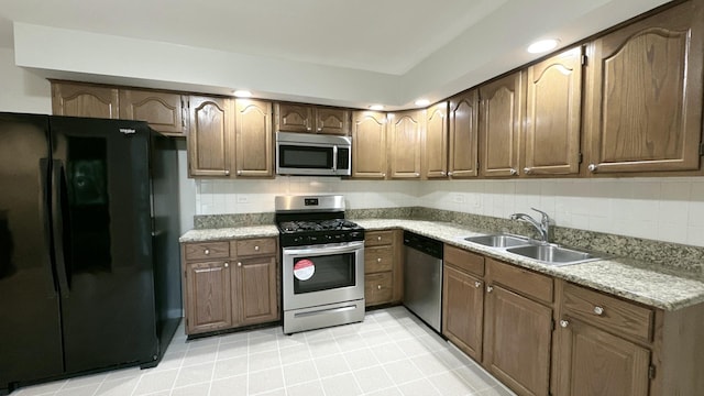 2931 Sunset Ave, Flossmoor, IL 60422 - kitchen with appliances with stainless steel finishes, light countertops, tasteful backsplash, and light tile patterned floors