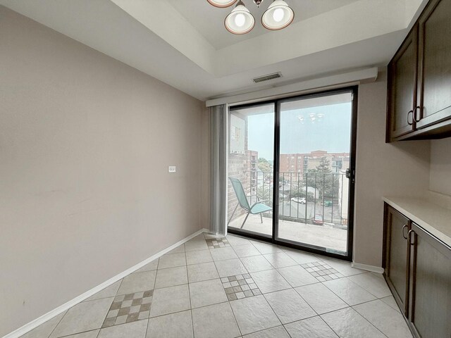 555 Graceland Ave Unit 505, Des Plaines, IL 60016 - unfurnished dining area featuring a chandelier and light tile patterned floors