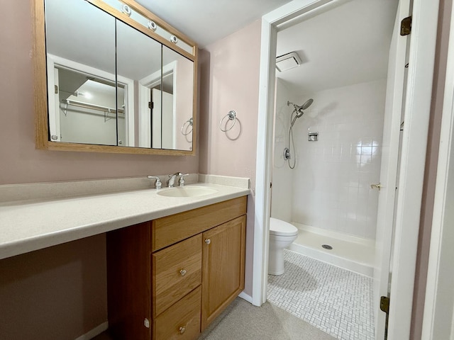 555 Graceland Ave Unit 505, Des Plaines, IL 60016 - bathroom featuring vanity, a tile shower, and tile patterned flooring