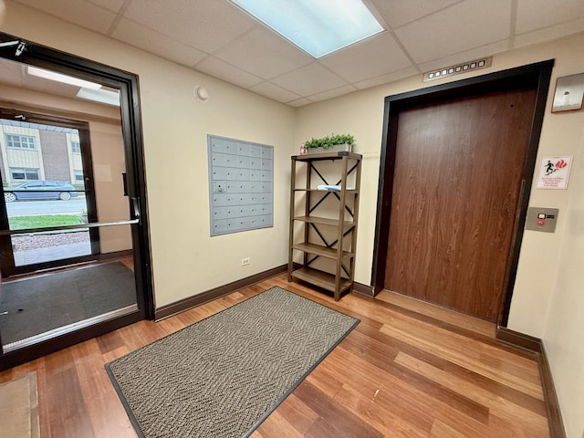 555 Graceland Ave Unit 505, Des Plaines, IL 60016 - entryway with a paneled ceiling, wood finished floors, and mail area