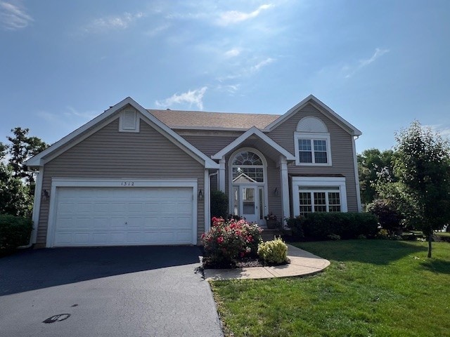 1312 Strawbridge Ct, Naperville, IL 60565 - traditional home featuring asphalt driveway, a front lawn, and a garage