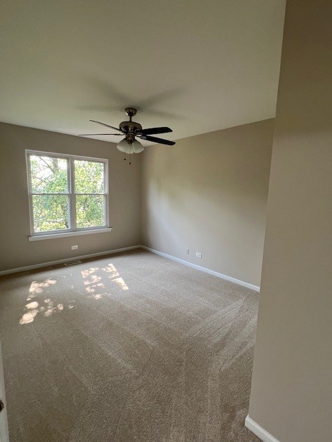 1312 Strawbridge Ct, Naperville, IL 60565 - carpeted empty room featuring baseboards and a ceiling fan