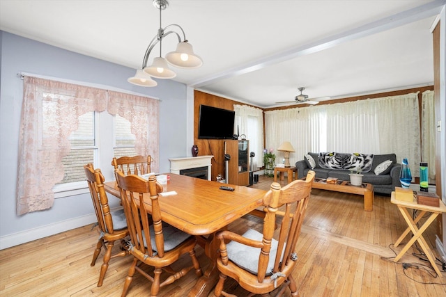 2142 N Mobile Ave, Chicago, IL 60639 - dining room with light wood-style floors and a ceiling fan