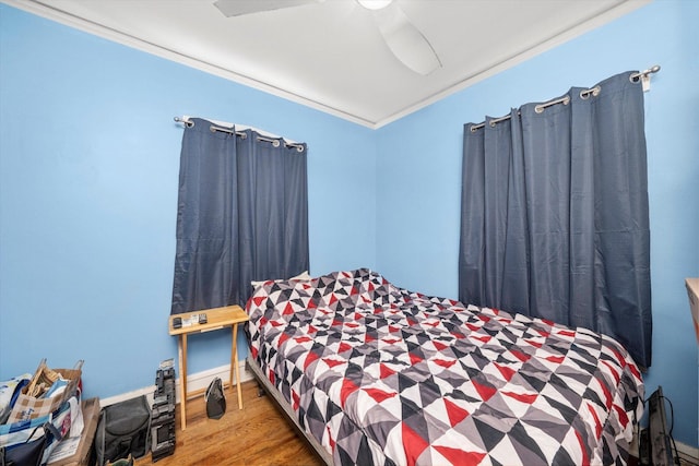 2142 N Mobile Ave, Chicago, IL 60639 - bedroom with crown molding, wood finished floors, and a ceiling fan