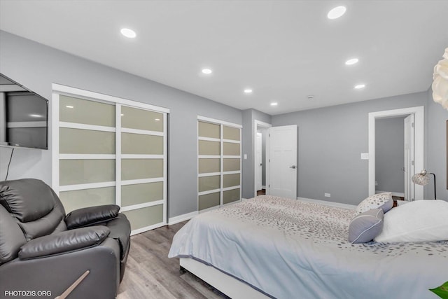 2600 Brookwood Way Dr Unit 111A, Rolling Meadows, IL 60008 - bedroom featuring wood finished floors, recessed lighting, and multiple closets