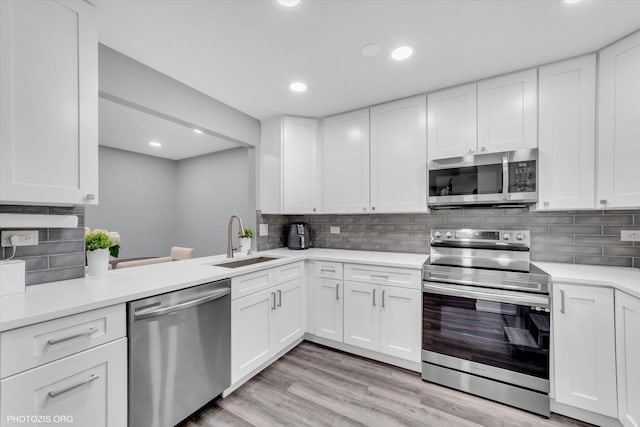 2600 Brookwood Way Dr Unit 111A, Rolling Meadows, IL 60008 - kitchen with appliances with stainless steel finishes, light countertops, backsplash, and recessed lighting