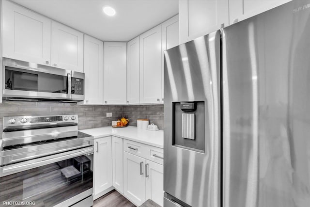 2600 Brookwood Way Dr Unit 111A, Rolling Meadows, IL 60008 - kitchen featuring stainless steel appliances, white cabinets, light countertops, and backsplash