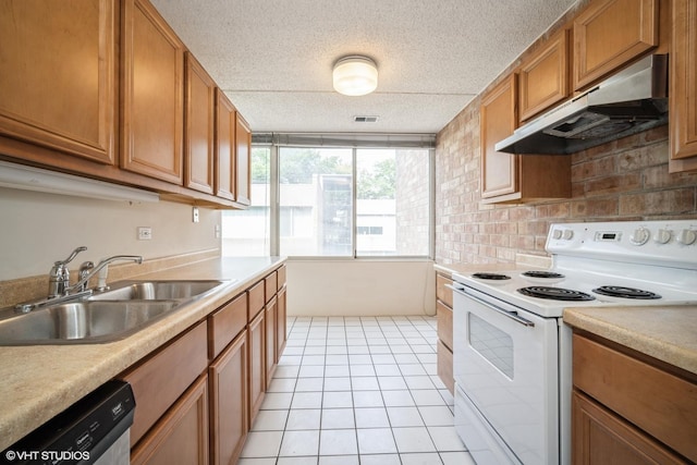 2020 St Johns Ave Unit 309, Highland Park, IL 60035 - kitchen with white electric range oven, under cabinet range hood, brown cabinets, light countertops, and light tile patterned floors