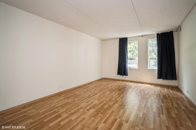 2020 St Johns Ave Unit 309, Highland Park, IL 60035 - unfurnished room with light wood-type flooring