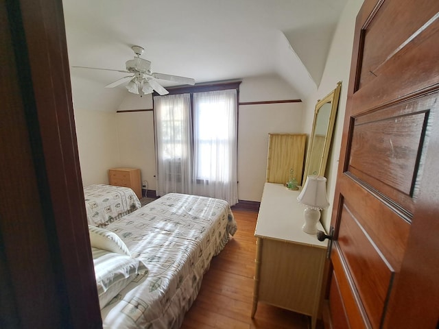 5922 W Dakin St, Chicago, IL 60634 - bedroom featuring lofted ceiling, wood finished floors, and a ceiling fan