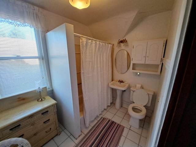 5922 W Dakin St, Chicago, IL 60634 - full bathroom featuring tile patterned flooring, vaulted ceiling, and shower / bathtub combination with curtain