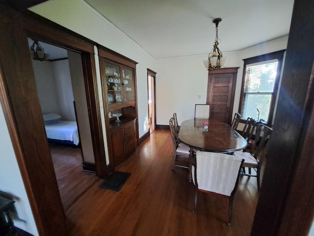 5922 W Dakin St, Chicago, IL 60634 - dining room featuring dark wood-type flooring and baseboards