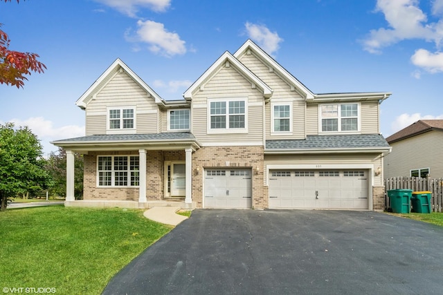 805 W Mystic Ln, Romeoville, IL 60446 - view of front of property featuring brick siding, asphalt driveway, and an attached garage