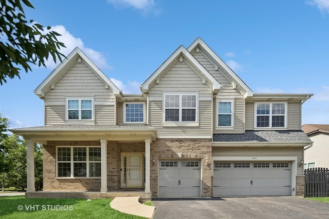 805 W Mystic Ln, Romeoville, IL 60446 - view of front of property with brick siding, asphalt driveway, a garage, and a shingled roof