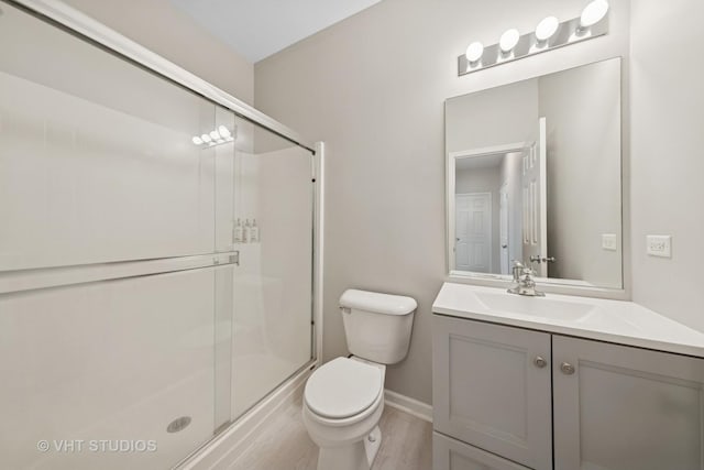 805 W Mystic Ln, Romeoville, IL 60446 - full bath featuring vanity, a stall shower, and wood finished floors