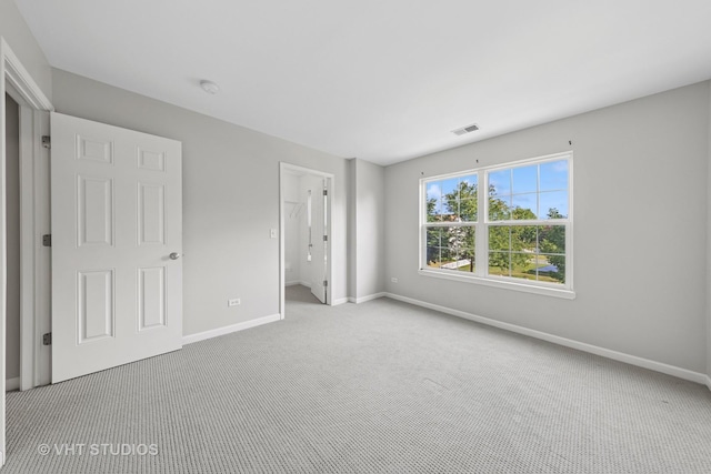 805 W Mystic Ln, Romeoville, IL 60446 - unfurnished bedroom featuring carpet flooring and a spacious closet
