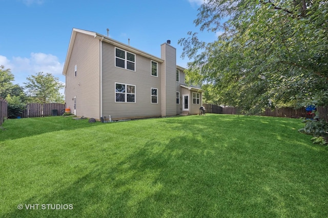 805 W Mystic Ln, Romeoville, IL 60446 - rear view of property featuring a chimney and a fenced backyard