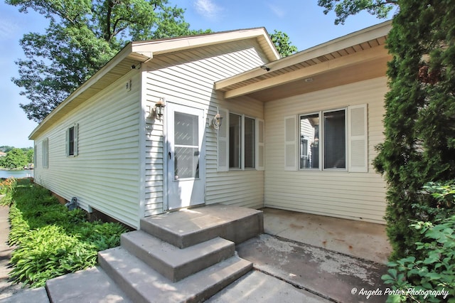 1803 N Woodlawn Park Ave, Mchenry, IL 60051 - view of exterior entry with a patio area