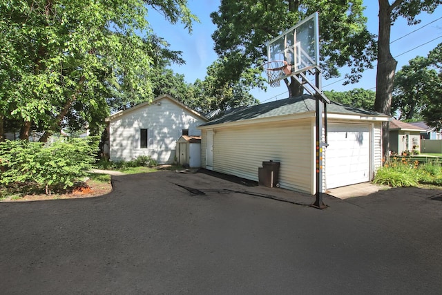 1803 N Woodlawn Park Ave, Mchenry, IL 60051 - garage featuring driveway