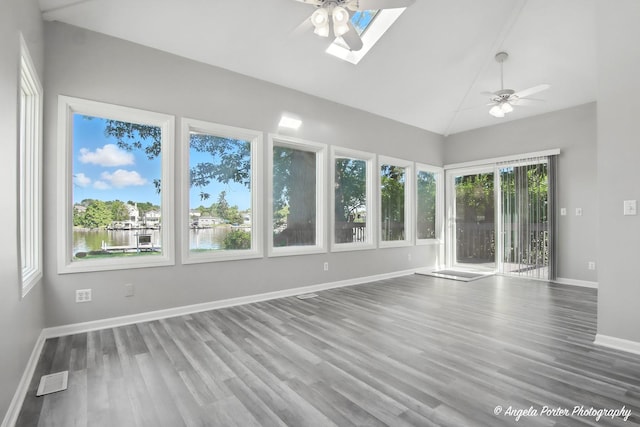 1803 N Woodlawn Park Ave, Mchenry, IL 60051 - unfurnished sunroom featuring lofted ceiling, a skylight, wood finished floors, and a water view