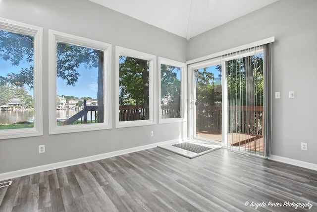 1803 N Woodlawn Park Ave, Mchenry, IL 60051 - unfurnished room featuring plenty of natural light, wood finished floors, and a water view
