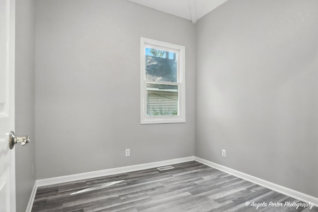 1803 N Woodlawn Park Ave, Mchenry, IL 60051 - empty room with wood finished floors and baseboards