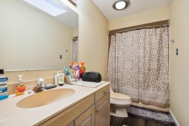 5932 W 75th Pl, Burbank, IL 60459 - bathroom featuring a skylight, vanity, wood finished floors, and curtained shower